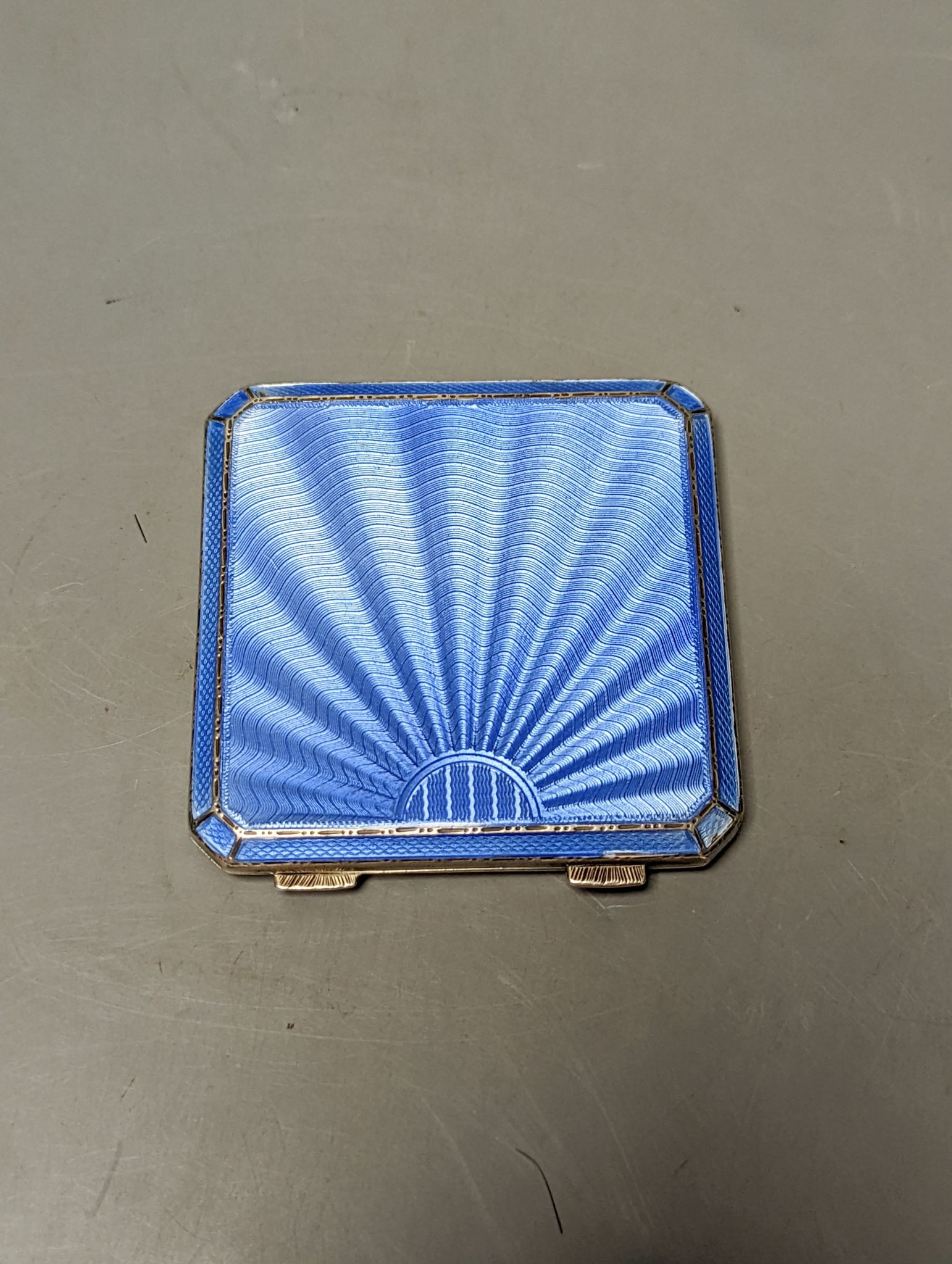 A 1930's At Deco Asprey & Co silver and blue guilloche enamel compact, 74mm.